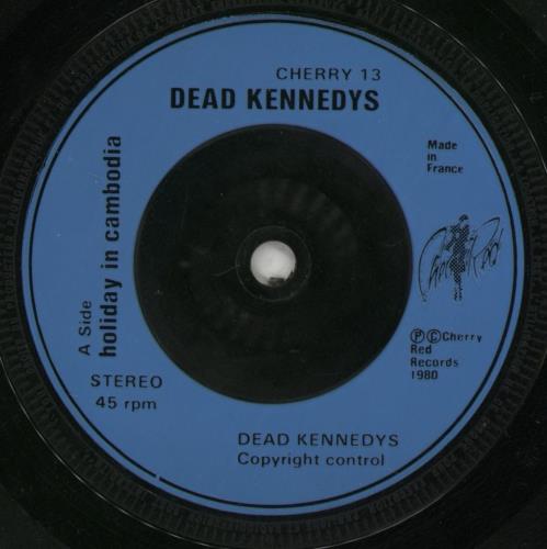 Dead Kennedys Holiday In Cambodia - Plane Sleeve + Blue injection - VG 7" vinyl single (7 inch record / 45) UK DKN07HO866217