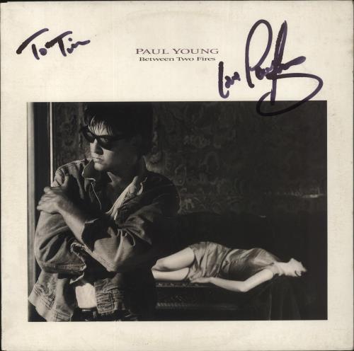 Paul Young Between Two Fires - Autographed vinyl LP album (LP record) UK PYOLPBE854787