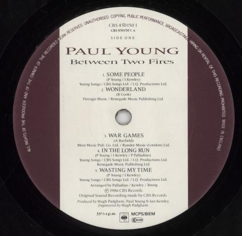 Paul Young Between Two Fires - Autographed vinyl LP album (LP record) UK PYOLPBE854787