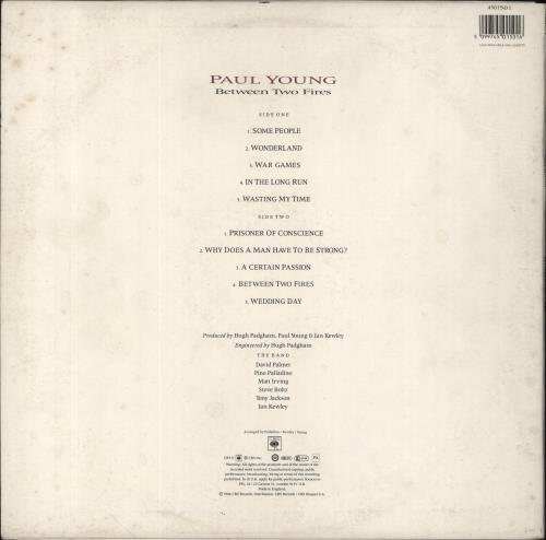 Paul Young Between Two Fires - Autographed vinyl LP album (LP record) UK PYOLPBE854787
