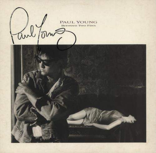 Paul Young Between Two Fires - Autographed vinyl LP album (LP record) UK PYOLPBE874362