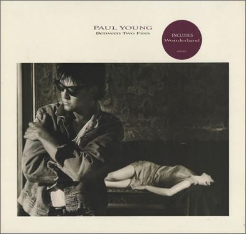 Paul Young Between Two Fires vinyl LP album (LP record) UK PYOLPBE231408