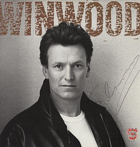 Steve Winwood Roll With It - Autographed! vinyl LP album (LP record) UK WWDLPRO311610