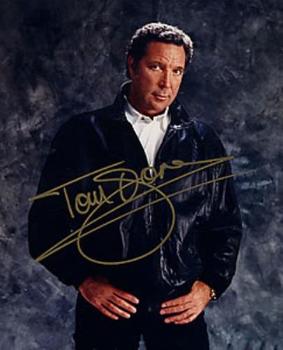 Tom Jones Signed Photoraph - standing wearing a leather jacket photograph UK TJOPHSI258321